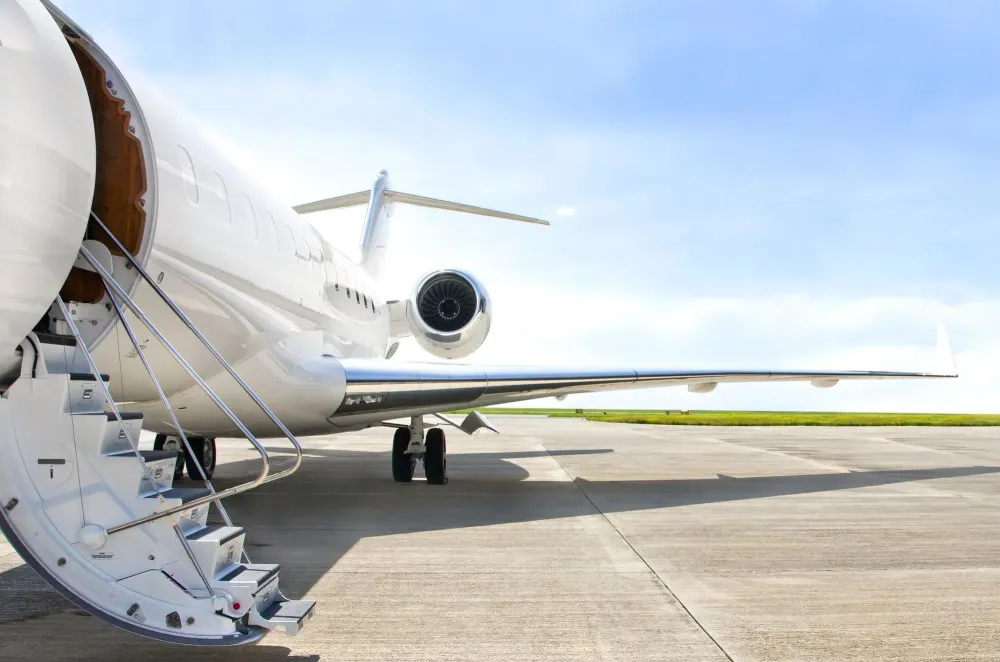 Exterior of a private jet with stairs lowered at the entrance